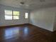 Living room with wood floors and large window at 1420 Ne 22Nd St, Ocala, FL 34470