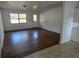 Bright living room featuring wood-look floors and lots of natural light at 1420 Ne 22Nd St, Ocala, FL 34470