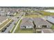 Aerial view of home, neighborhood, and lake at 19041 Blueleaf St, Orlando, FL 32827
