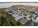 Aerial view of neighborhood including waterfront at 1965 Van Buren Loop, Auburndale, FL 33823