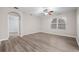 Large bedroom with ceiling fan and access to bathroom at 1965 Van Buren Loop, Auburndale, FL 33823