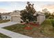 House exterior with landscaping and driveway at 1965 Van Buren Loop, Auburndale, FL 33823