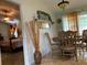 Bright dining area with wood table and chairs, view to bedroom at 306 Medina Ct, Kissimmee, FL 34758