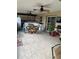 Large screened porch with multiple fans and outdoor kitchen at 306 Medina Ct, Kissimmee, FL 34758