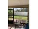 Screened porch with bench and backyard view at 306 Medina Ct, Kissimmee, FL 34758