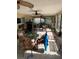 Spacious screened porch with tile floor, ceiling fans, and outdoor furniture at 306 Medina Ct, Kissimmee, FL 34758