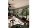 Bright screened porch features tile flooring and access to backyard at 306 Medina Ct, Kissimmee, FL 34758