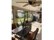 Enjoy this screened porch with tiled floor and outdoor seating at 306 Medina Ct, Kissimmee, FL 34758