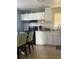 Bright kitchen with white cabinets, stove, and breakfast area at 3407 Avenue J Nw, Winter Haven, FL 33881