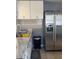 Efficient kitchen with white cabinets and stainless steel appliances at 3407 Avenue J Nw, Winter Haven, FL 33881