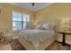 Bedroom with a queen bed and a cozy armchair at 5043 Vantage Ct, St Cloud, FL 34772