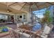 Covered patio with outdoor dining set and umbrella at 5043 Vantage Ct, St Cloud, FL 34772