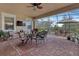 Spacious covered patio with pavers, dining furniture, and ceiling fan at 5043 Vantage Ct, St Cloud, FL 34772