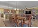 Elegant dining room with a large wooden table and matching chairs at 5043 Vantage Ct, St Cloud, FL 34772