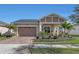 Well maintained home with lush landscaping and a two car garage at 5043 Vantage Ct, St Cloud, FL 34772
