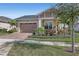 Beautiful one-story home with a two-car garage and lush landscaping at 5043 Vantage Ct, St Cloud, FL 34772