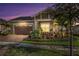 Inviting one-story home with a landscaped front yard and a two-car garage at 5043 Vantage Ct, St Cloud, FL 34772