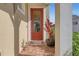 Red front door with a glass panel and a welcome mat at 5043 Vantage Ct, St Cloud, FL 34772
