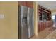 Stainless steel refrigerator built into kitchen cabinetry at 5043 Vantage Ct, St Cloud, FL 34772
