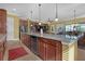 Kitchen island with granite countertop and seating at 5043 Vantage Ct, St Cloud, FL 34772