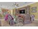 Living room with built-in shelving, large TV, and comfortable seating at 5043 Vantage Ct, St Cloud, FL 34772