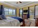 Main bedroom with TV, large windows, and ample space at 5043 Vantage Ct, St Cloud, FL 34772