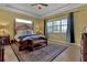 Spacious main bedroom with a large window and comfortable seating at 5043 Vantage Ct, St Cloud, FL 34772