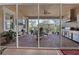 Covered outdoor patio with kitchen, dining area, and relaxing seating at 5043 Vantage Ct, St Cloud, FL 34772