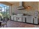 Stainless steel outdoor kitchen with built-in grill and appliances at 5043 Vantage Ct, St Cloud, FL 34772