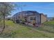 Spacious screened patio with pavers and lush landscaping at 5043 Vantage Ct, St Cloud, FL 34772