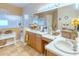Elegant bathroom with double vanity, large mirror, and shower at 521 Milano Rd, Kissimmee, FL 34759