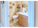 Charming updated bathroom with decorative accents and light wood vanity at 521 Milano Rd, Kissimmee, FL 34759