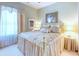 Serene bedroom with a king-size bed and brass frame at 521 Milano Rd, Kissimmee, FL 34759