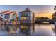 Spanish style clubhouse with water views at sunset at 521 Milano Rd, Kissimmee, FL 34759
