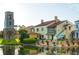 Community clubhouse with bell tower and water views at 521 Milano Rd, Kissimmee, FL 34759