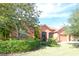 Well-maintained home with lush landscaping, creating curb appeal at 521 Milano Rd, Kissimmee, FL 34759