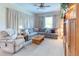Relaxing Gathering room with sectional sofa and built-in entertainment center at 521 Milano Rd, Kissimmee, FL 34759
