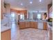 Open concept kitchen boasts an island, breakfast nook, and stainless steel appliances at 521 Milano Rd, Kissimmee, FL 34759