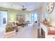 Bright and airy living room featuring a cozy seating area and fireplace at 521 Milano Rd, Kissimmee, FL 34759