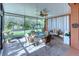 Spacious screened porch with paver patio and comfortable seating area at 521 Milano Rd, Kissimmee, FL 34759