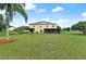 Large backyard with spacious lawn and solar panels on the house at 558 Nogales Ct, Kissimmee, FL 34758