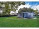 Gray house exterior with a landscaped yard at 7709 Ravenna Ave, Orlando, FL 32819