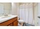 Clean bathroom with shower/tub combo and wood vanity at 8958 Sugar Palm Rd, Kissimmee, FL 34747