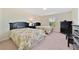 Bedroom with two twin beds, floral bedding, and ample closet space at 8958 Sugar Palm Rd, Kissimmee, FL 34747