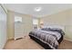 Bedroom with king-size bed, dresser and window at 8958 Sugar Palm Rd, Kissimmee, FL 34747