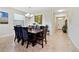 Formal dining room with a large wooden table and eight chairs at 8958 Sugar Palm Rd, Kissimmee, FL 34747
