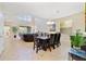 Bright dining room with large wooden table and seating for six at 8958 Sugar Palm Rd, Kissimmee, FL 34747