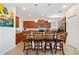 Modern kitchen with granite countertops and stainless steel appliances at 8958 Sugar Palm Rd, Kissimmee, FL 34747