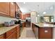 Modern kitchen with granite countertops and stainless steel appliances at 8958 Sugar Palm Rd, Kissimmee, FL 34747
