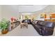 Spacious living room with large sectional sofa and high ceilings at 8958 Sugar Palm Rd, Kissimmee, FL 34747
